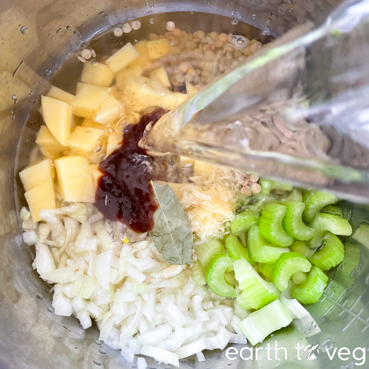 adding water to lentil soup ingredients