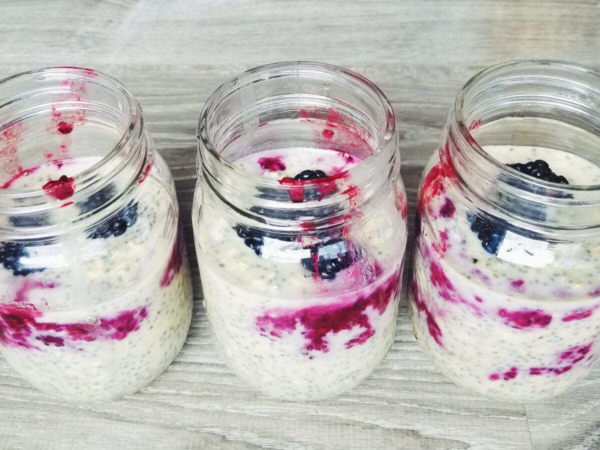 blackberry high protein overnight oats in mason jars