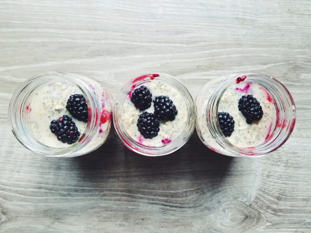 blackberry high protein overnight oats in mason jars