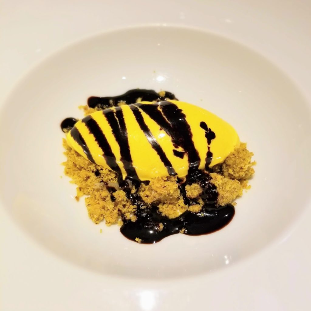 saffron ice cream with chocolate drizzle at il ridotto venice