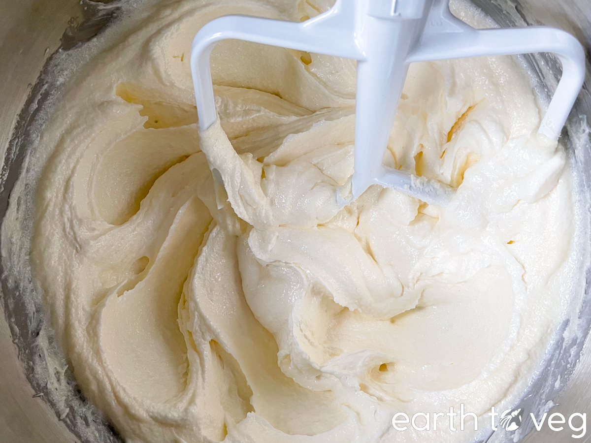 Butter and sugar are creamed together in a stand mixer until fluffy.