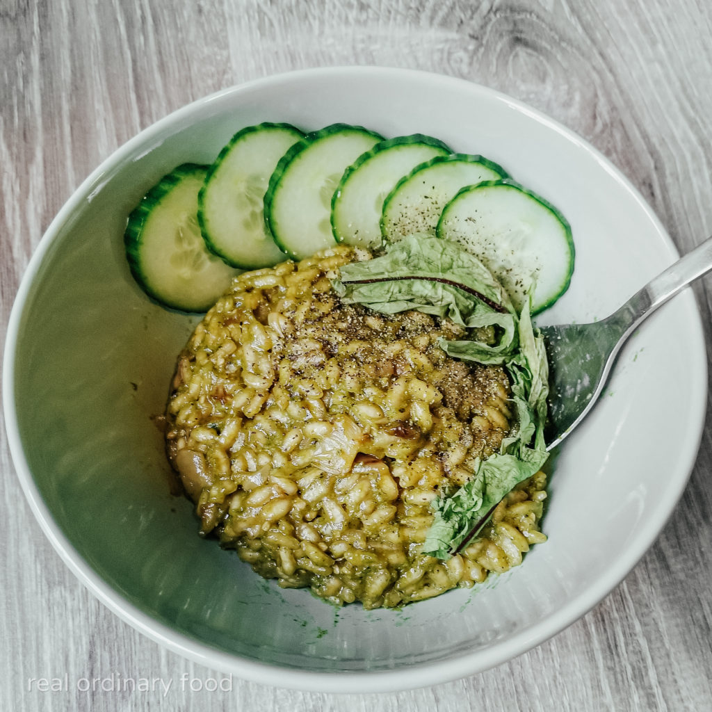 green dandelion risotto with cucumber slices