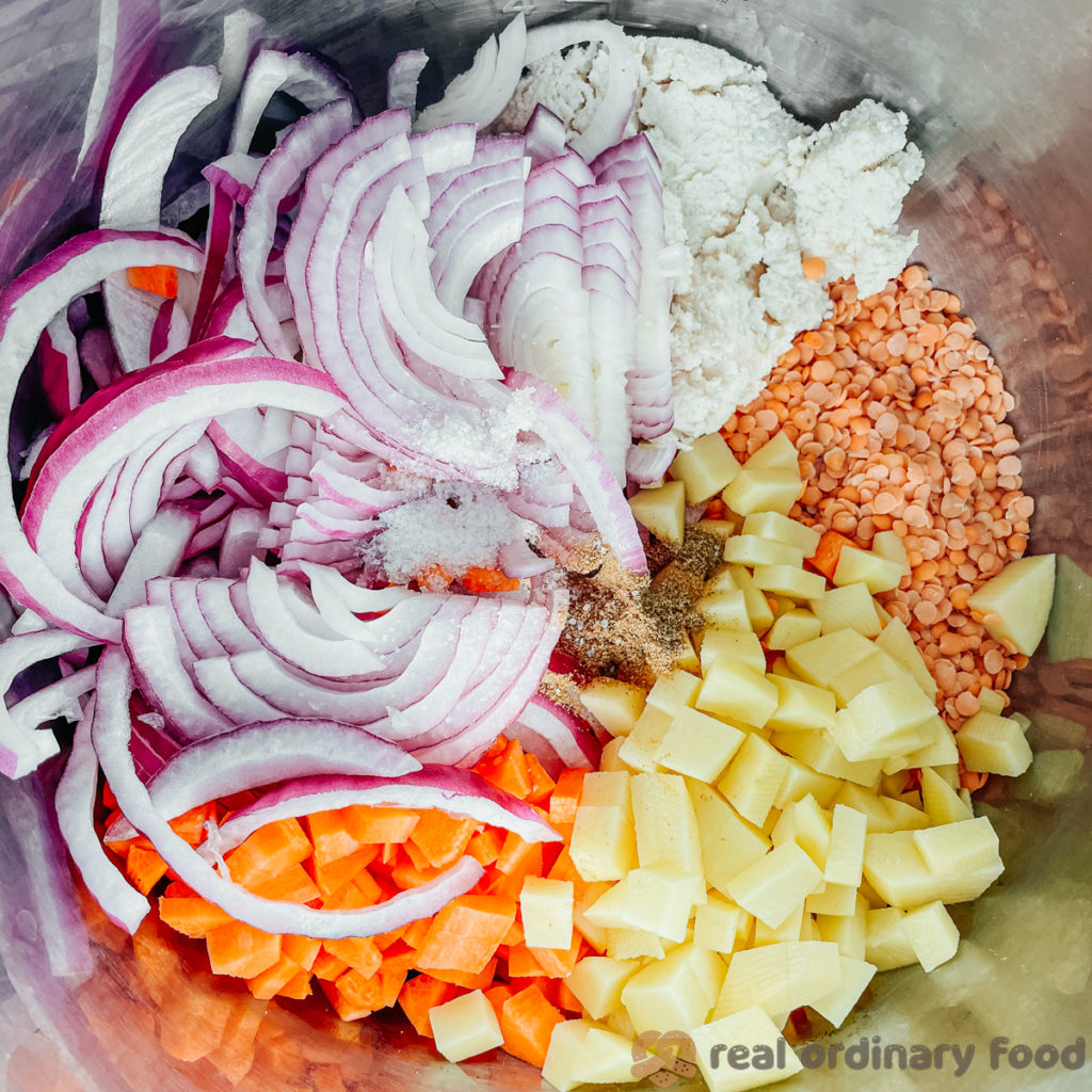 Chopped and prepped lentil soup ingredients in an Instant Pot.