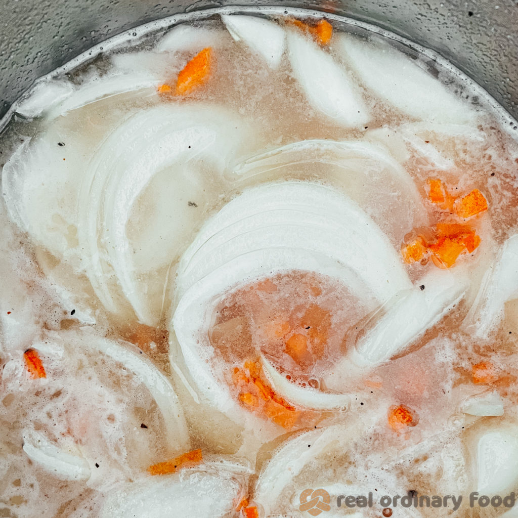 Lentil soup ingredients are mixed up in the Instant Pot.