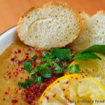 turkish lentil soup with pan de barra bread and lemon slices