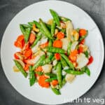 Stir fried lily bulbs plated on a white serving platter.