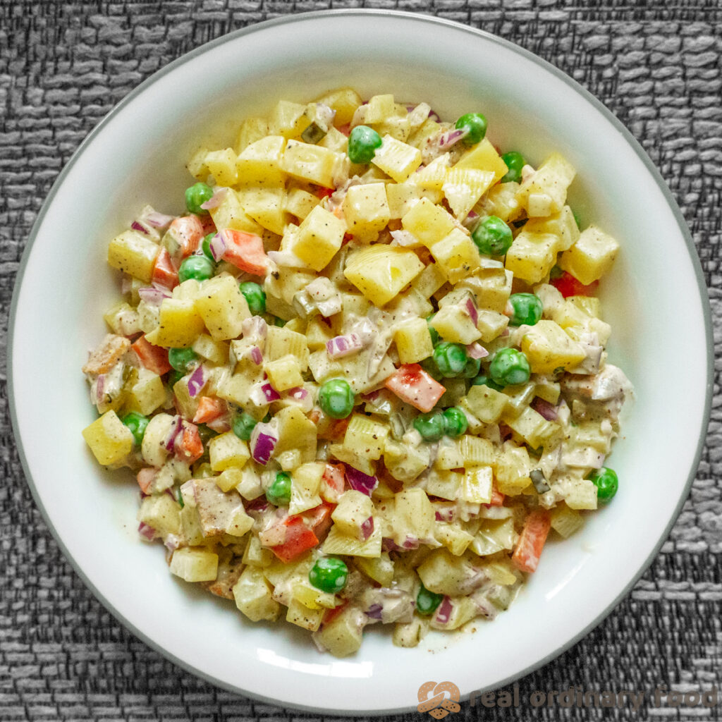 big bowl of vegan salad olivieh