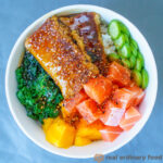 A bowl of vegan chirashi sushi with fresh vegetables.