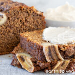 slices of rye flour banana bread spread with cream cheese