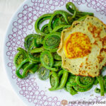sauteed fiddleheads with vegan fried egg