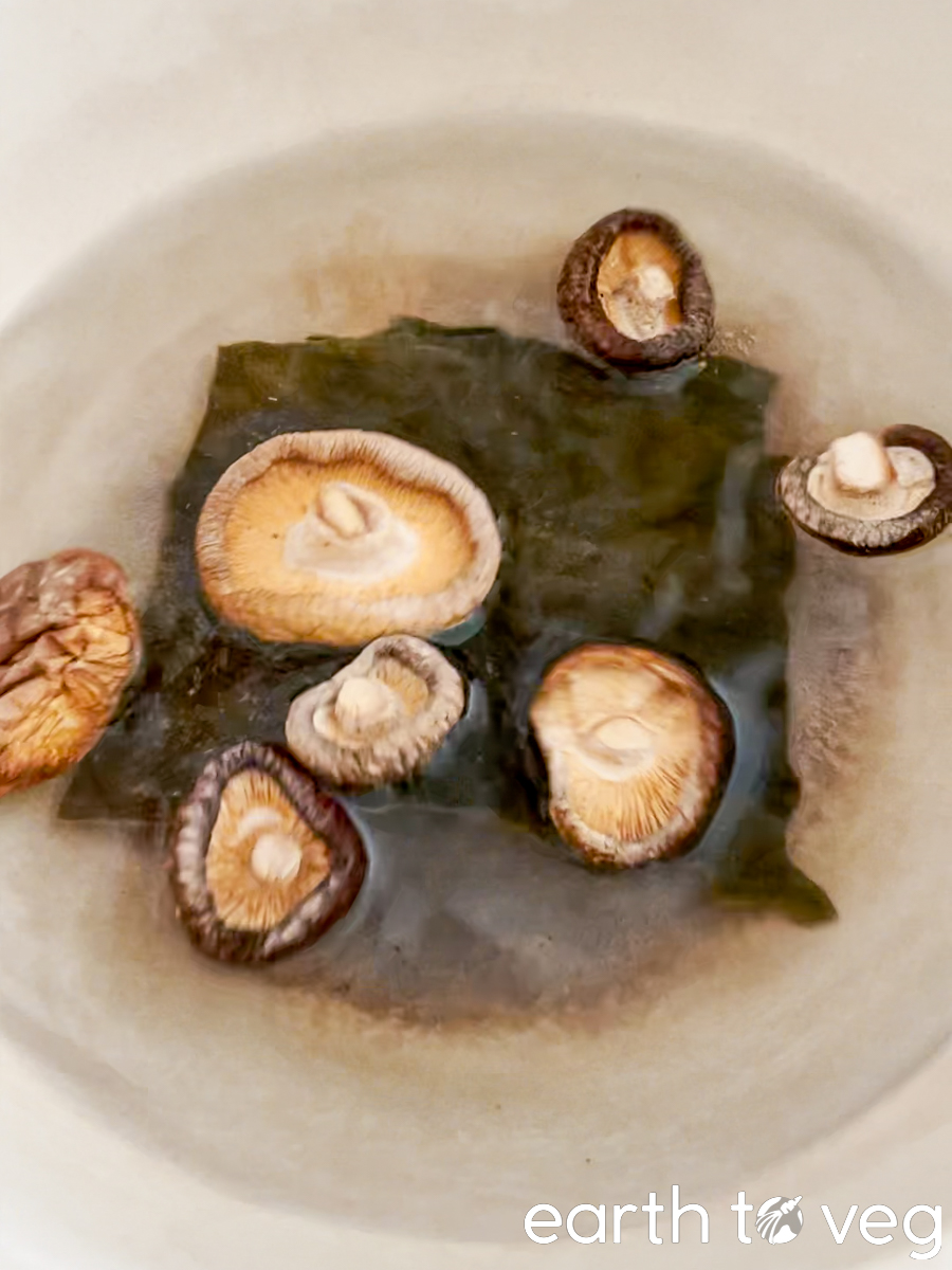 adding dried kelp and mushroom to make vegan yuksu stock