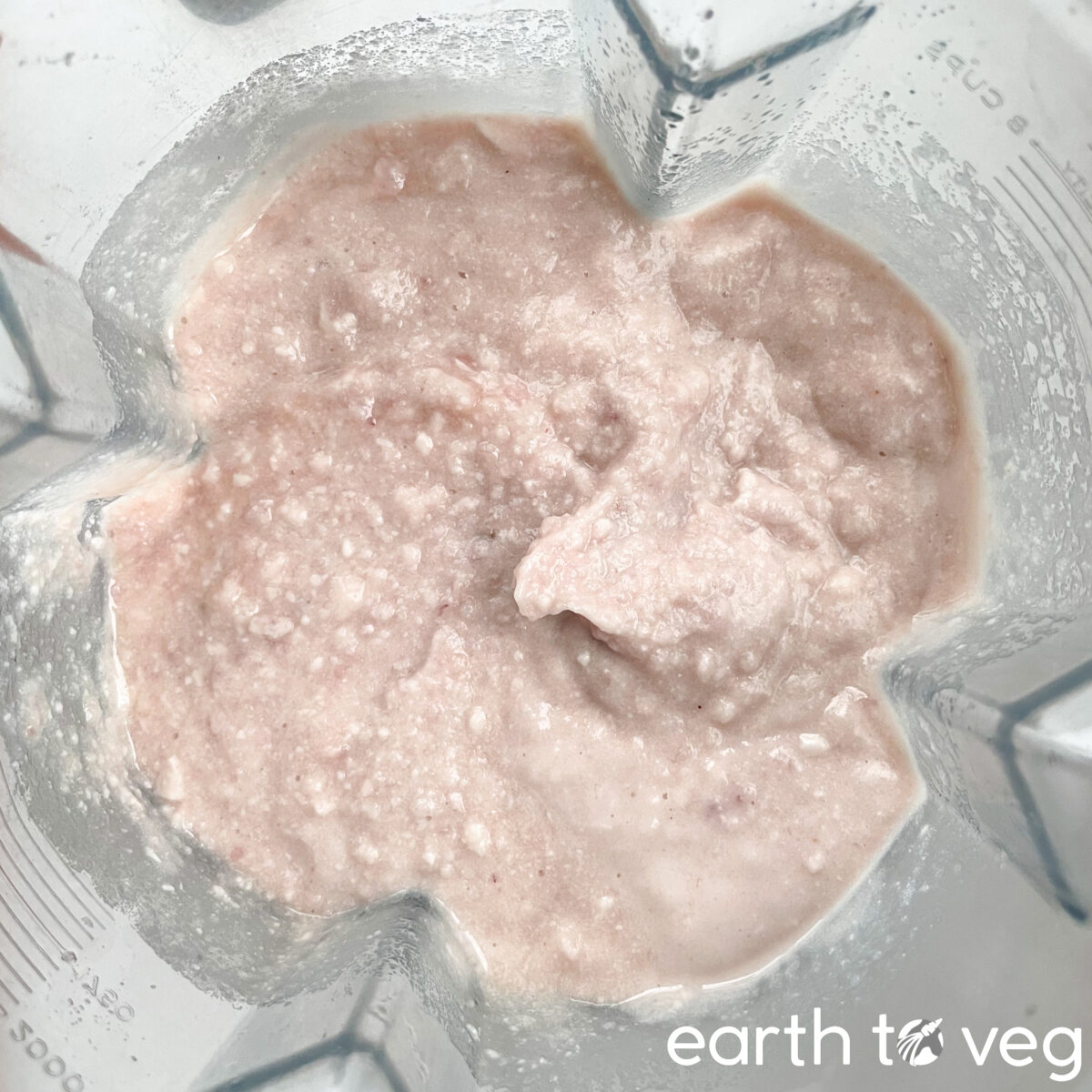 The taro and coconut milk are blended into a paste, with some small lumps here and there.