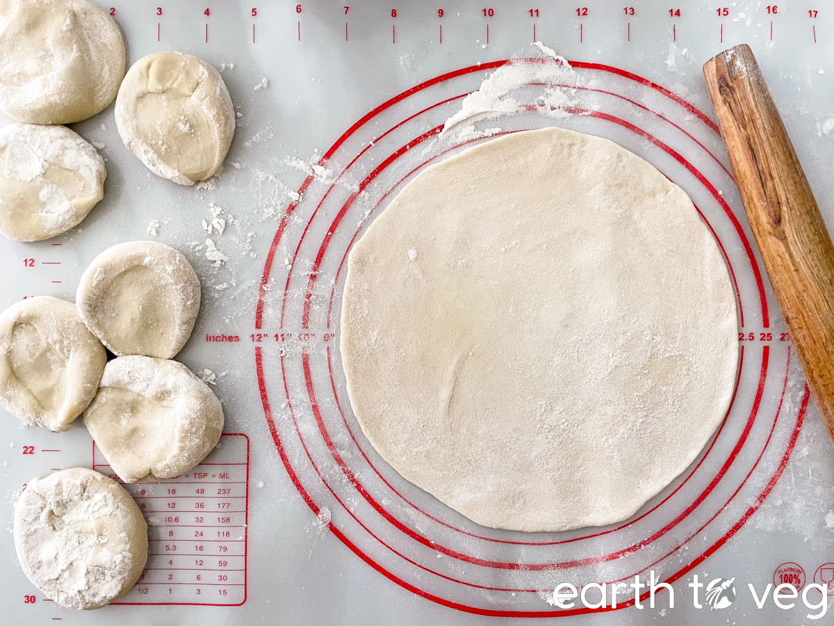 pieces of hot water dough being rolled out