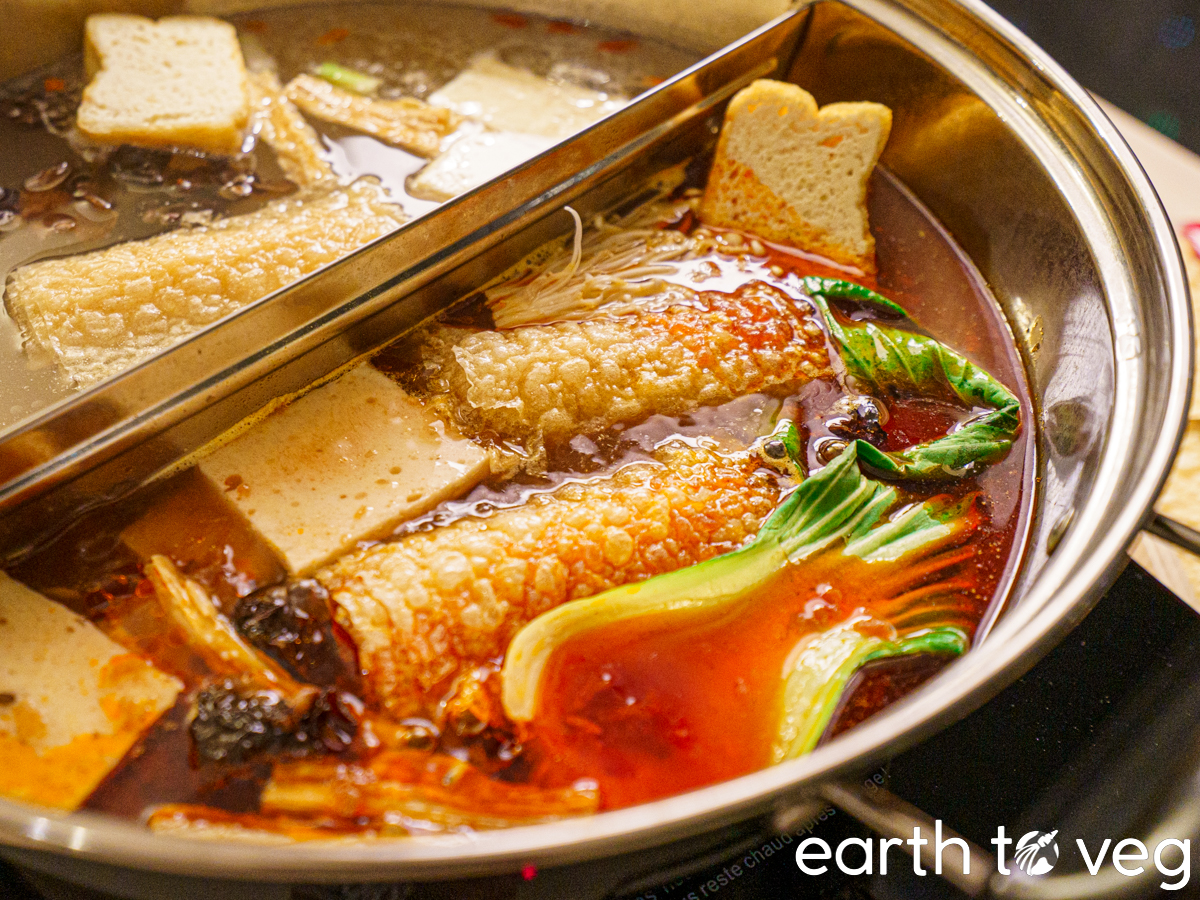 vegan chinese hot pot simmering in a spicy broth