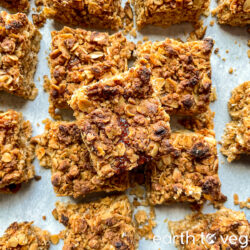 Icelandic rhubarb cake squares arranged haphazardly over a grey countertop.