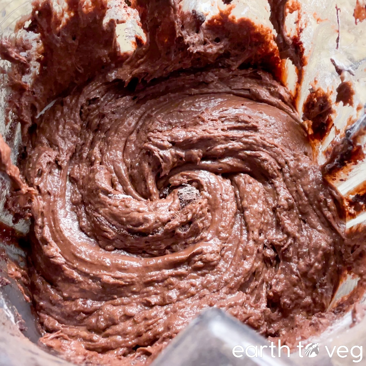 Thick chocolate cake batter is blended up in a Vitamix blender.