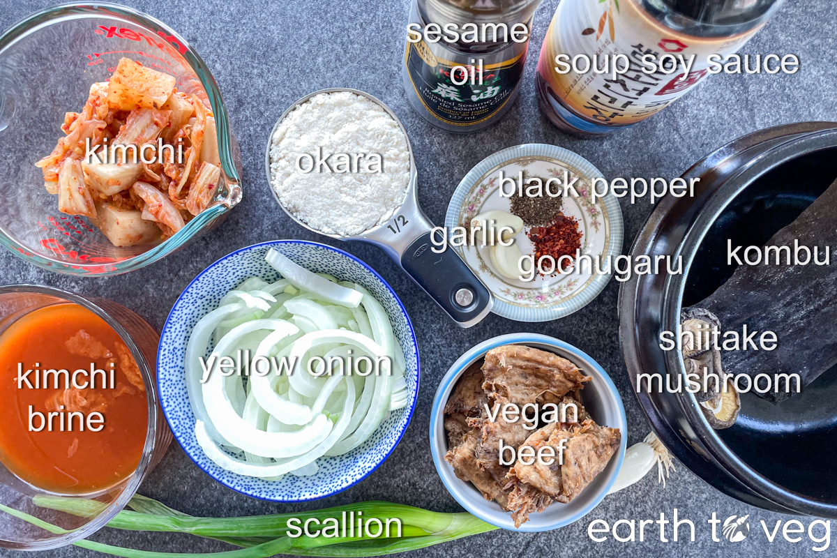 Ingredients for kongbiji jjigae laid out on a grey counter.