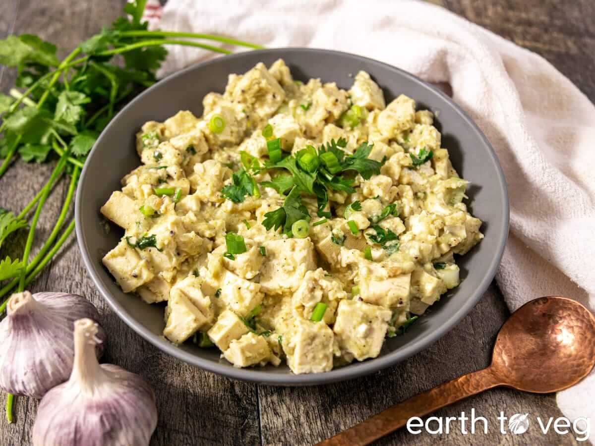 Coriander chutney tofu scramble garnished with fresh cilantro and scallions.